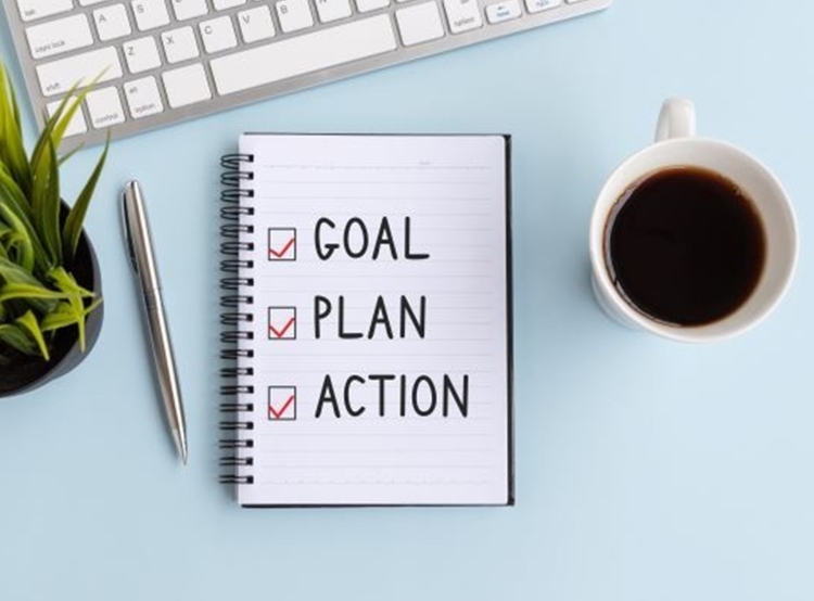 Notepad and Coffee Cup On Desk